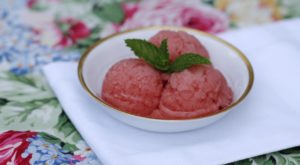 three watermelon sorbet balls in a bowl