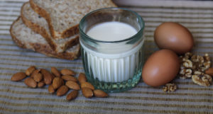 glass of milk, nuts, eggs, bread